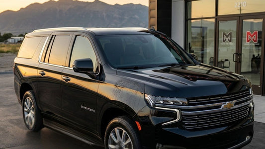 Black SUV with ceramic coating showing glossy finish and water beading on the paint surface